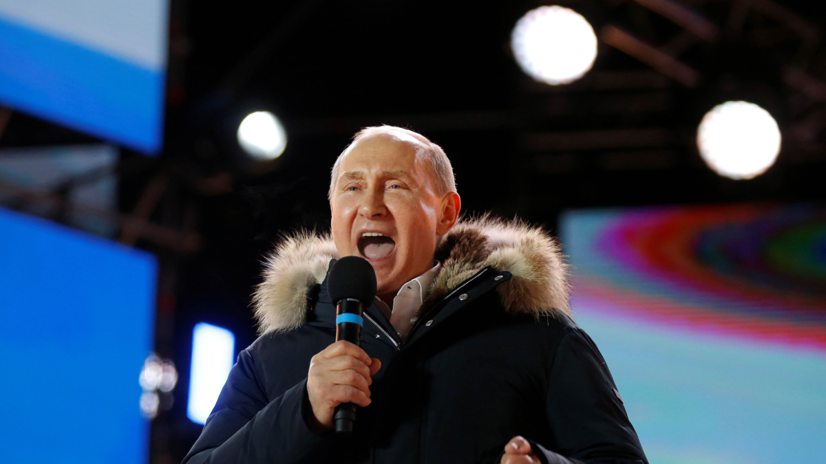 vladimir Putin shouting into a microphone