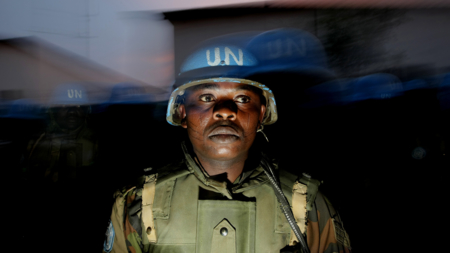 The image shows a UN peacekeepier