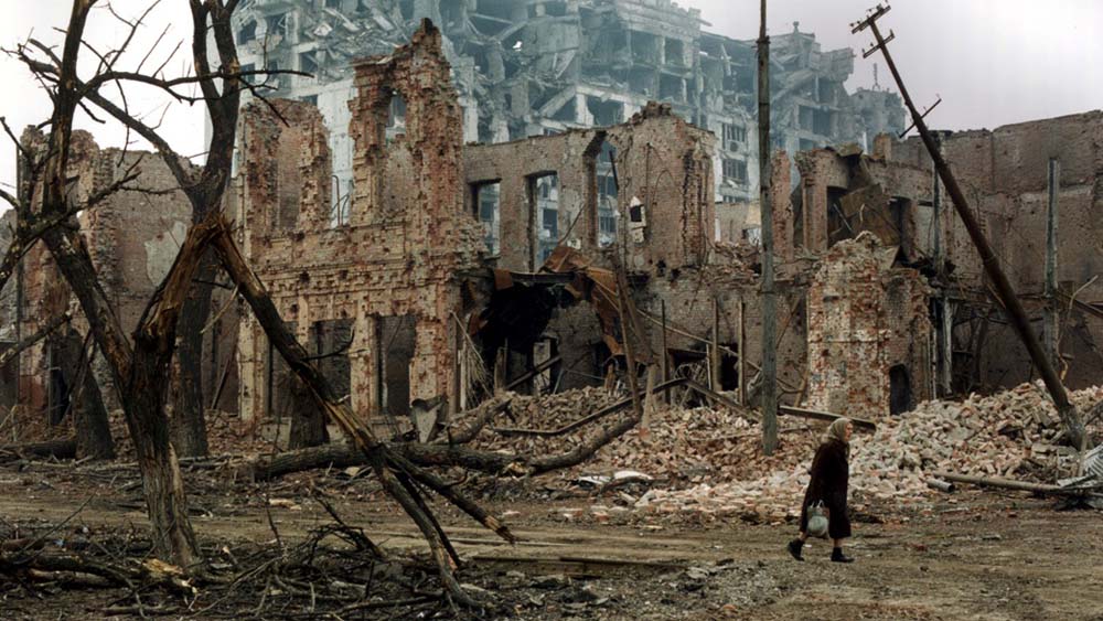 The image shows a bombed out Grozny in 1995.